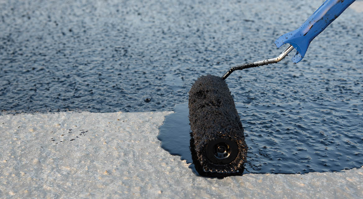 Roller brush waterproofing  Waterproofing coating  Copy space  Space for text 