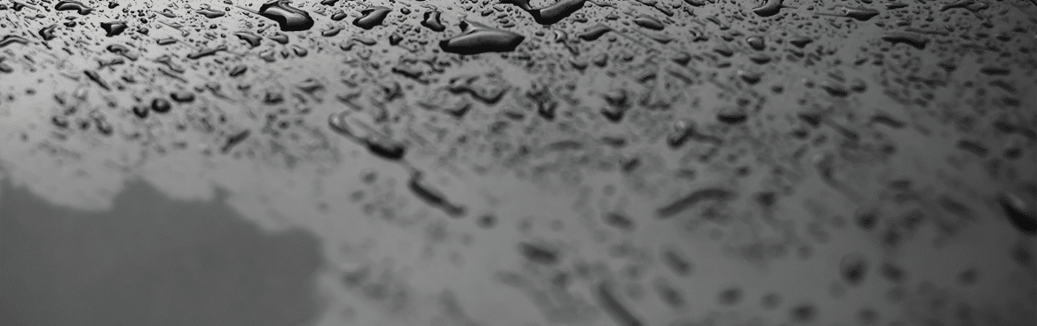 Rain drops and dew  water drops on a gray car roof after stopped raining , selective focus waterproof surface  soft focus  Leave space for writing text background 